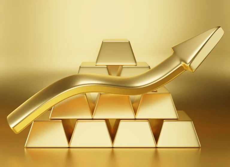 Златни прачки наредени на маса, симбол на инвестиции